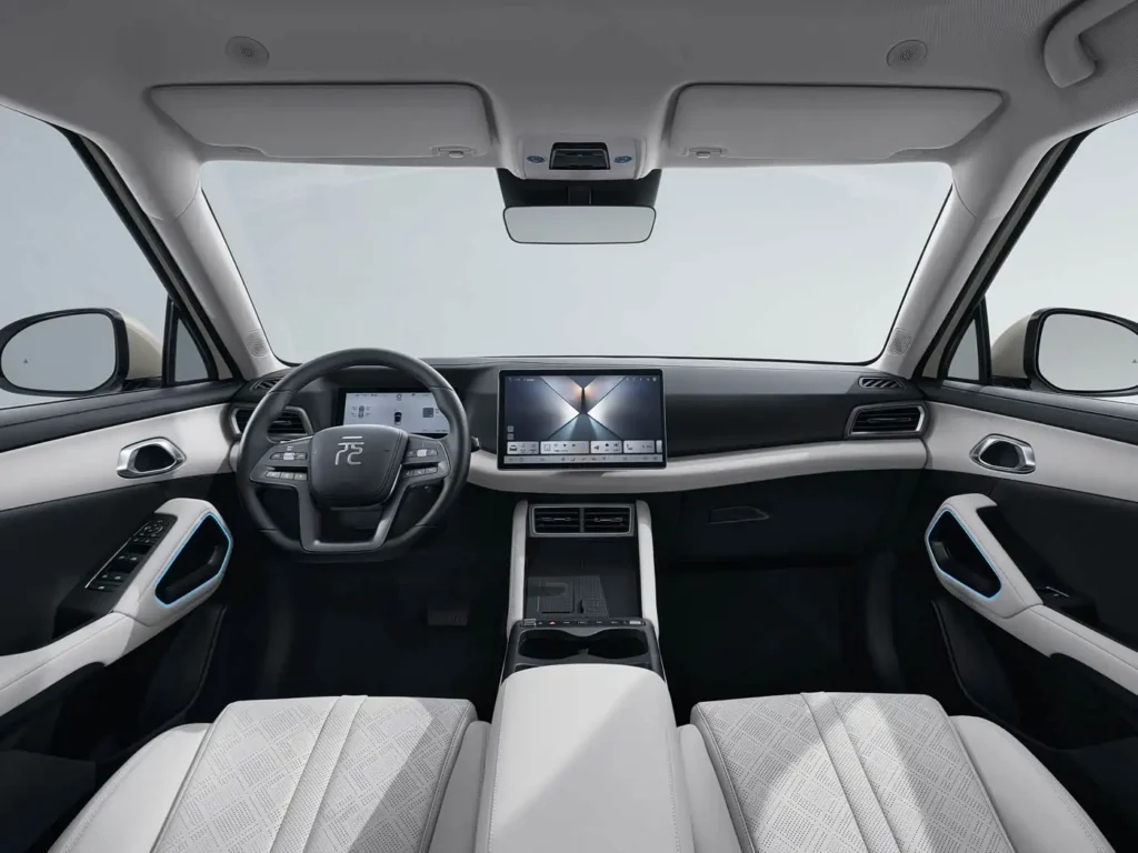 BYD Yuan Up panoramic interior view with dual-tone cabin, digital instrument panel, large central touchscreen, and spacious compact electric SUV layout