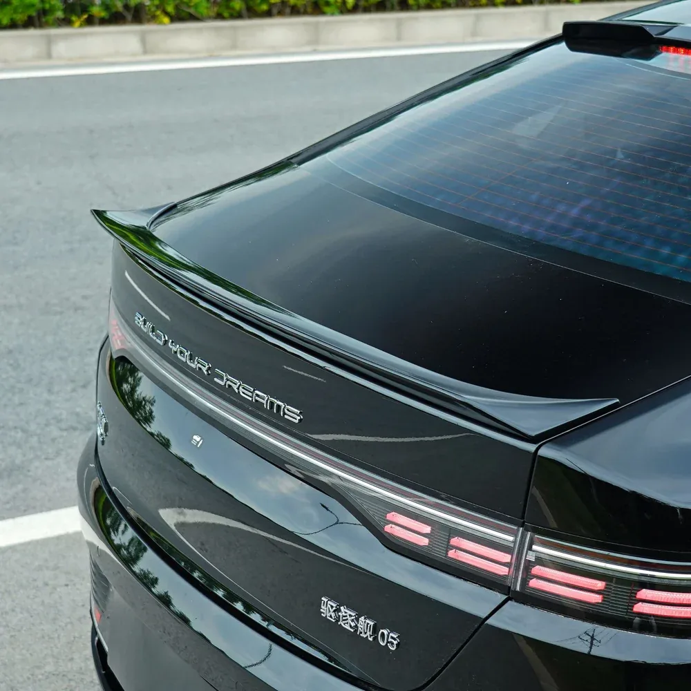 Rear spoiler wing in carbon-texture finish for a BYD, installed