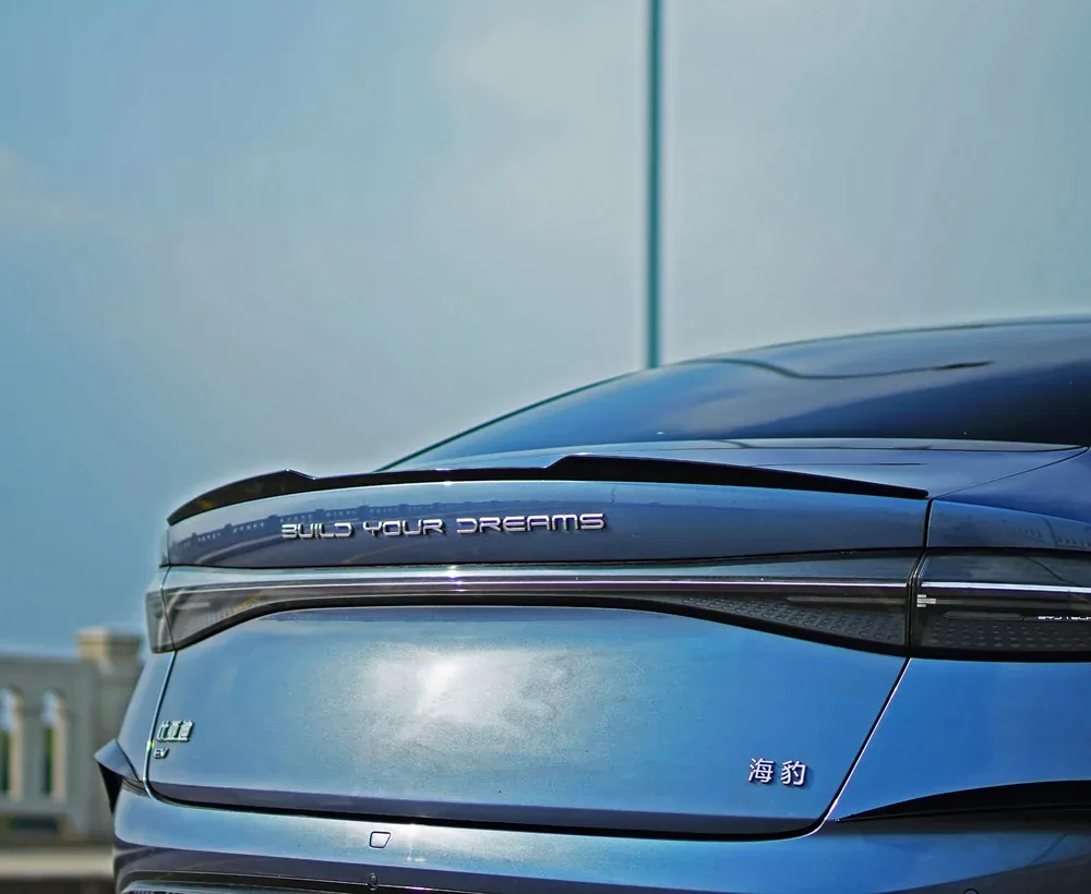 Close-up of a rear spoiler wing installed on the boot lid of a BYD Seal