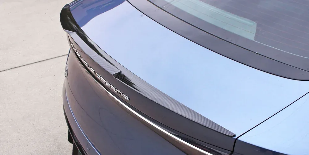 Carbon-texture rear spoiler installed on the boot lid of a BYD Seal