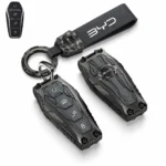 BYD armored smart key cover with round ring, leather-look loop and key fob on a white background