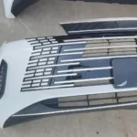 Three-quarter view of the white BYD Destroyer 05 front bumper with side fog light openings