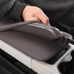 Stretching the silicone armrest cover over the BYD Song Plus armrest for easy slip-on inst