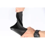 Flexible PVC mud flap bent by hand to show soft