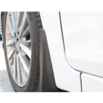 Mud flap installed behind the wheel