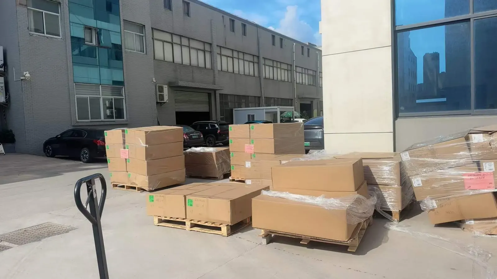 Boxed and palletized exterior parts shipment waiting outside the warehouse