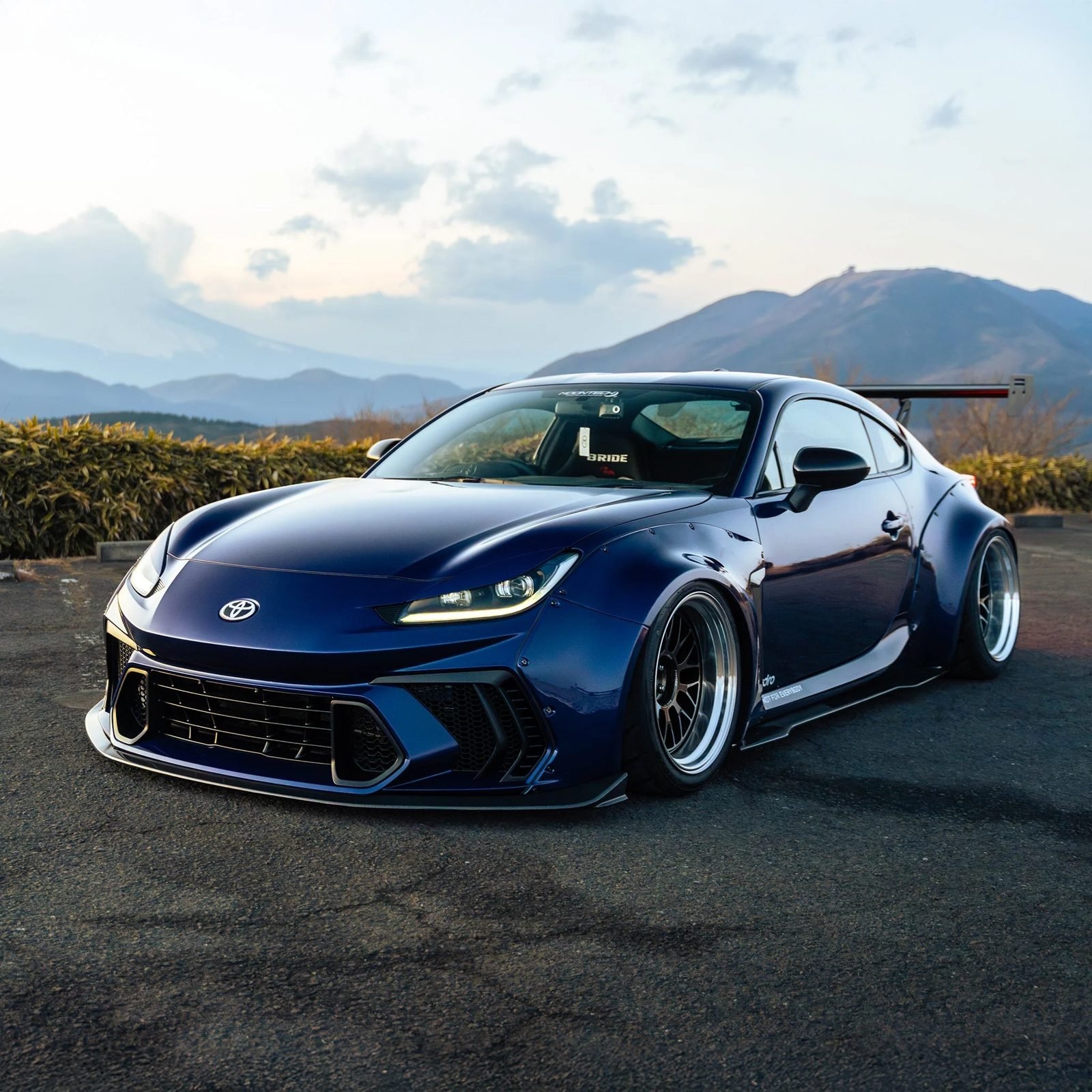 Toyota GR86 with a widebody kit: bolted-on fender flares, wide wheels and a low front splitter